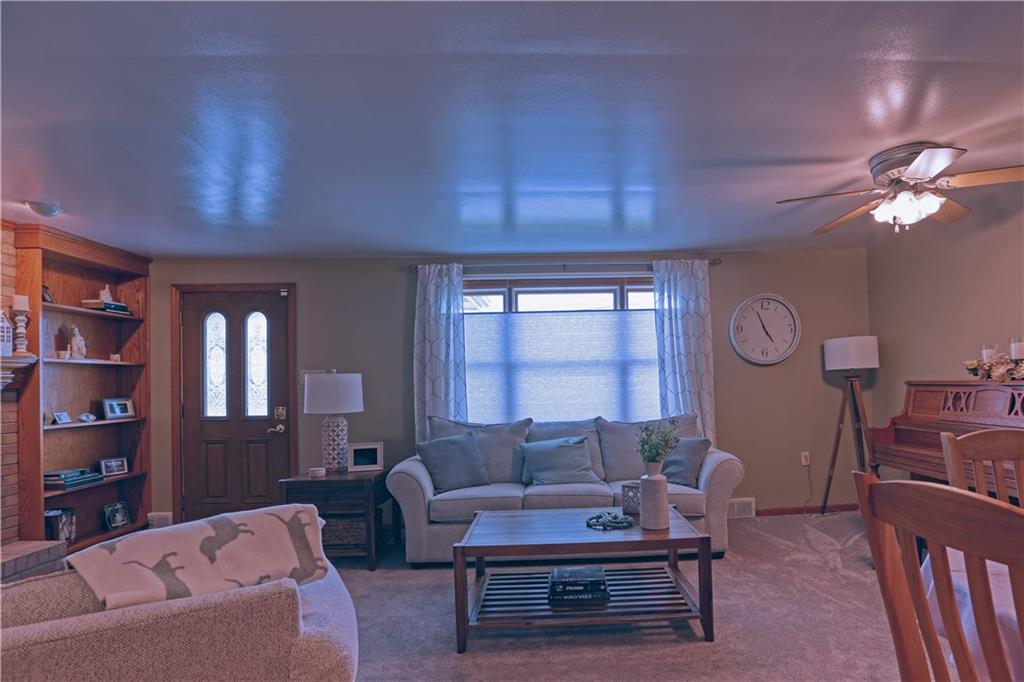 139 Miller Road Rochester, PA 15074 - Photo 21 of 33 a living room with furniture a window and a bookshelf