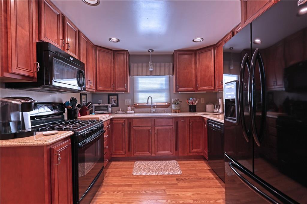 139 Miller Road Rochester, PA 15074 - Photo 7 of 33 a kitchen with stainless steel appliances granite countertop wooden cabinets a stove top oven a sink and dishwasher