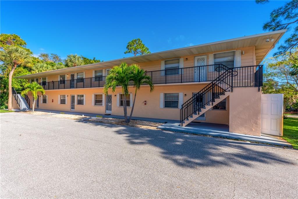 333 Southeast Martin Avenue, Unit 57 Stuart, FL 34996 - Photo 1 of 16 front view of a house with a street