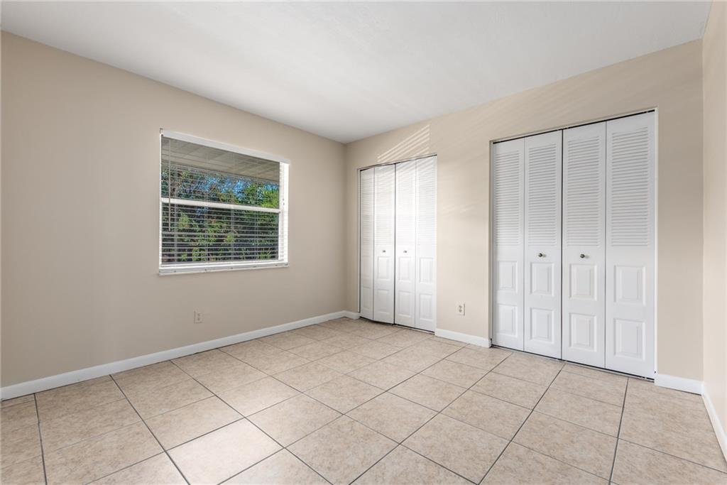 333 Southeast Martin Avenue, Unit 57 Stuart, FL 34996 - Photo 14 of 16 an empty room with windows