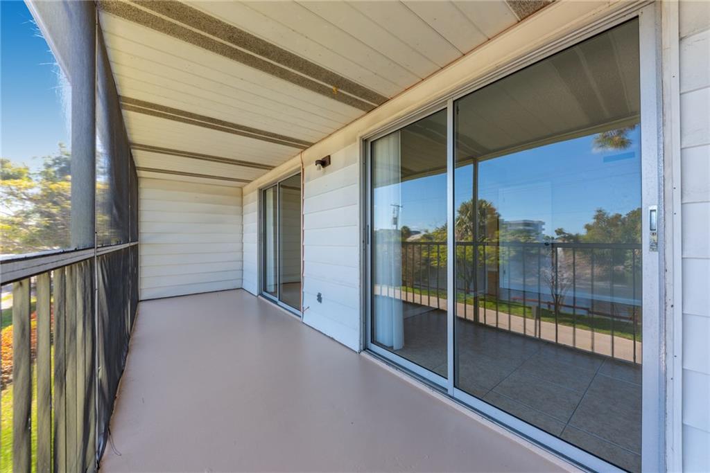 333 Southeast Martin Avenue, Unit 57 Stuart, FL 34996 - Photo 2 of 16 a view of a glass door of the house