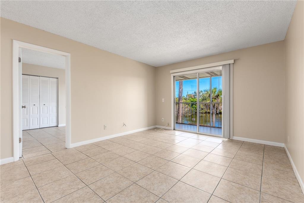 333 Southeast Martin Avenue, Unit 57 Stuart, FL 34996 - Photo 6 of 16 a view of an empty room and window