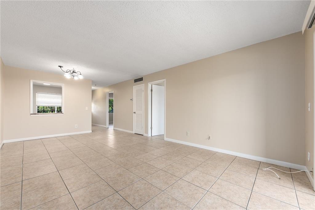 333 Southeast Martin Avenue, Unit 57 Stuart, FL 34996 - Photo 7 of 16 a view of an empty room and window