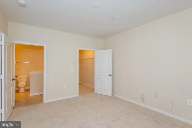 an empty room with outdoor view and a window