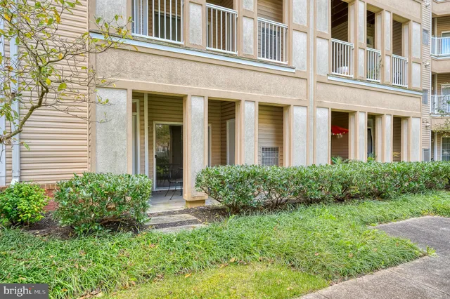 a large kitchen with a large window and stainless steel appliances