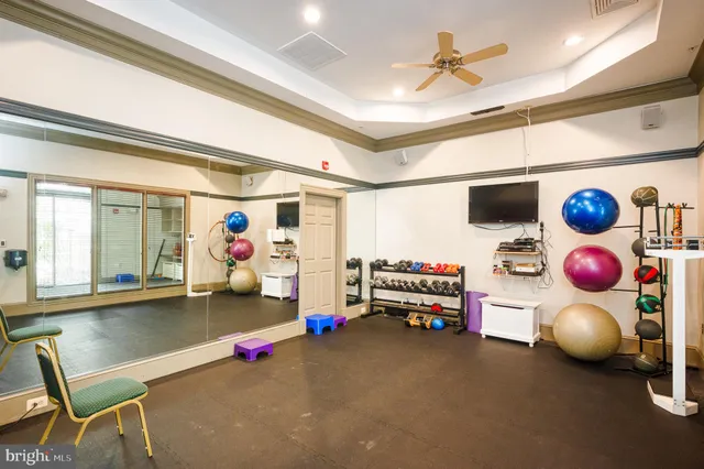 a living room with furniture toys and a book shelf