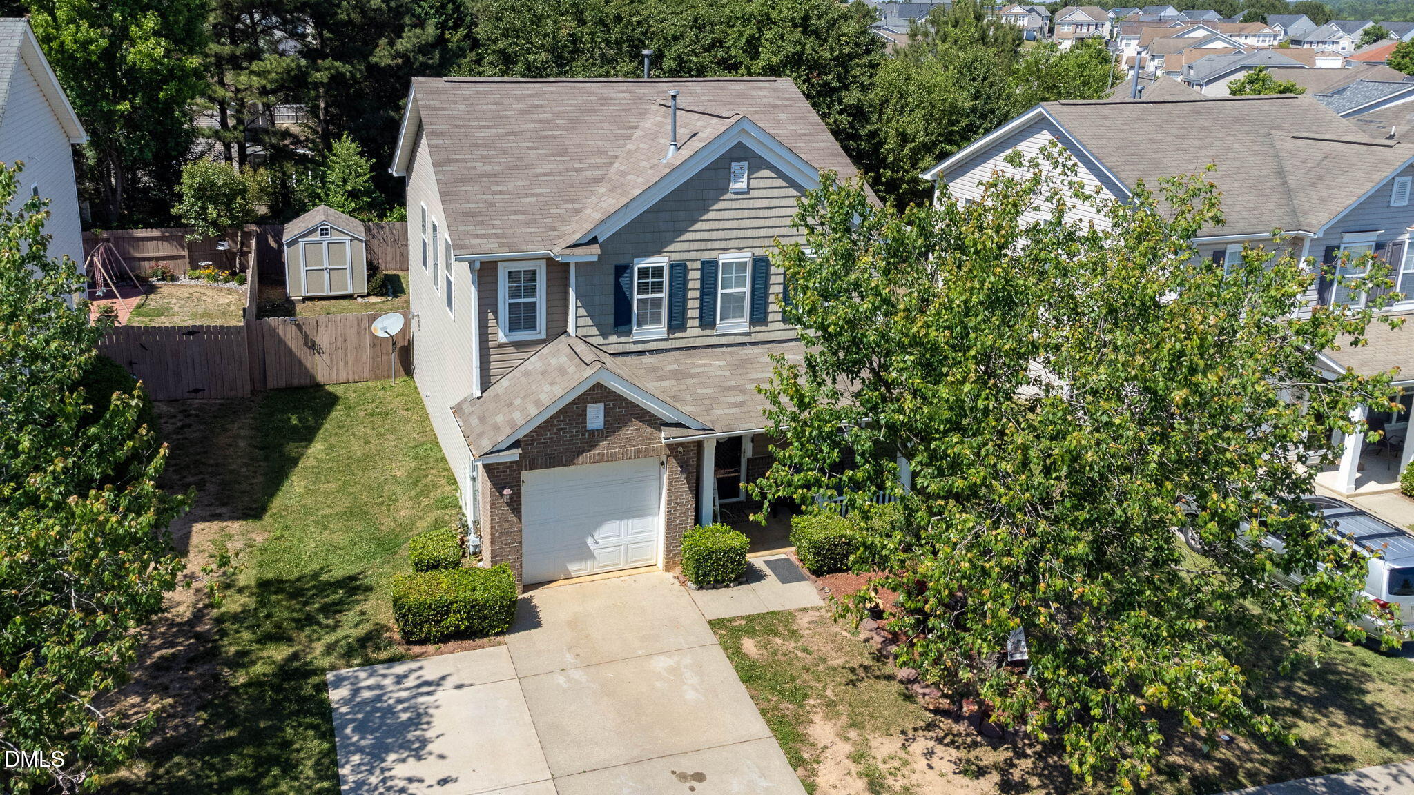 3713 Marshlane Way Raleigh, NC 27610 - Photo 33 of 38 a aerial view of a house with yard and green space