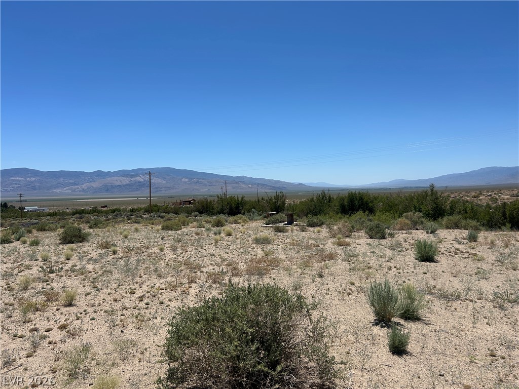 360 Mountain Creek Road Dyer, NV 89010 - Photo 6 of 23 Vast desert landscape with distant mountains under an expansive blue sky.