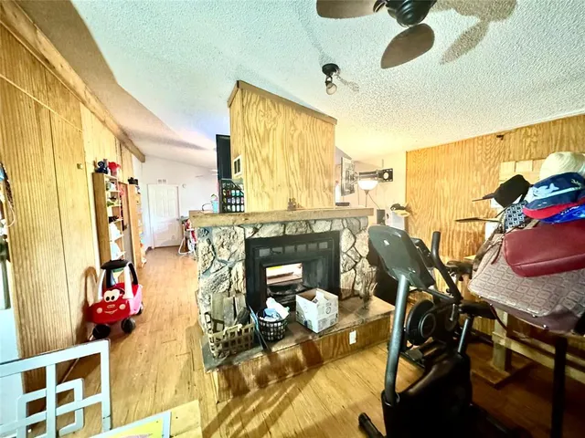 a view of a livingroom with furniture and a window