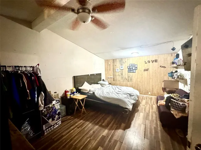 a bed room with a bed and a walk in closet