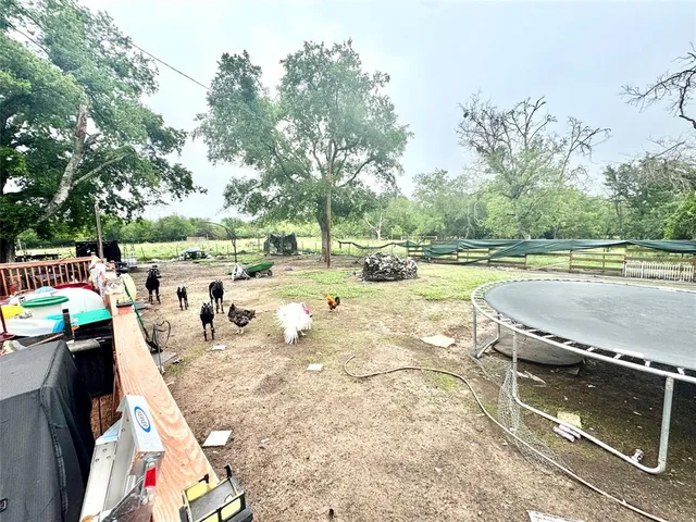 a view of a swimming pool with a patio