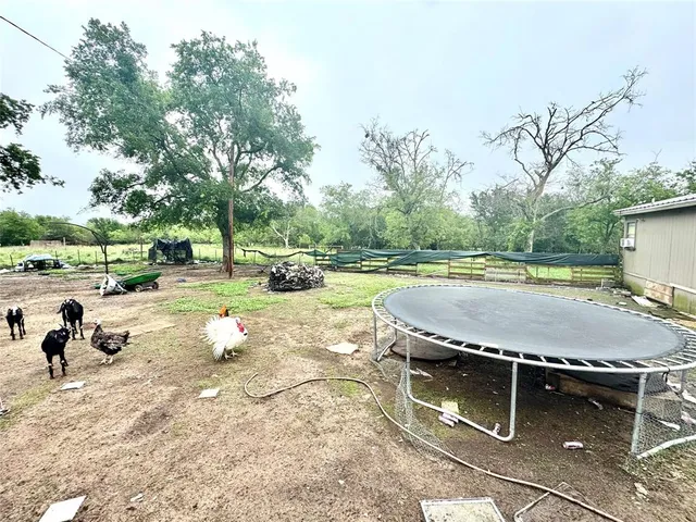 a view of a swimming pool with a patio