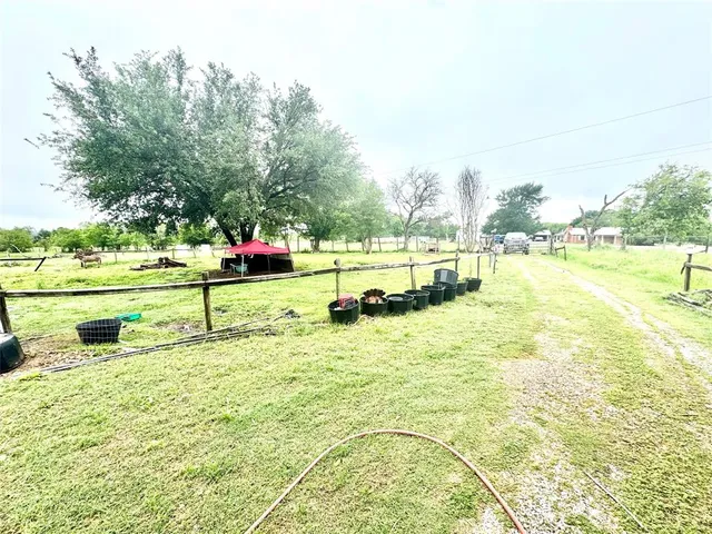 a view of a swimming pool with an outdoor space and seating area
