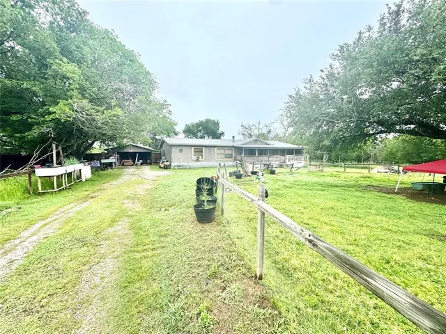 swimming pool view with a seating space