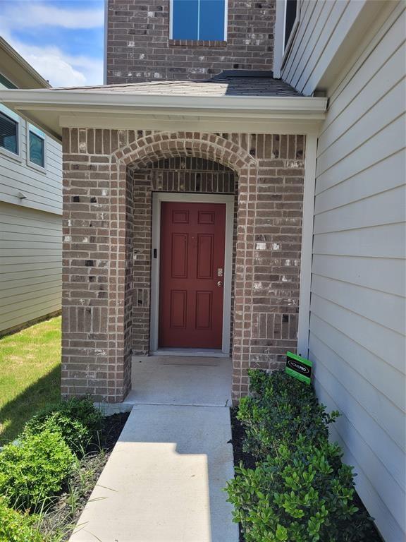 14917 Gypsum Mill Road Manor, TX 78653 - Photo 2 of 28 An inviting brick arched entry welcomes guests to this charming residence.