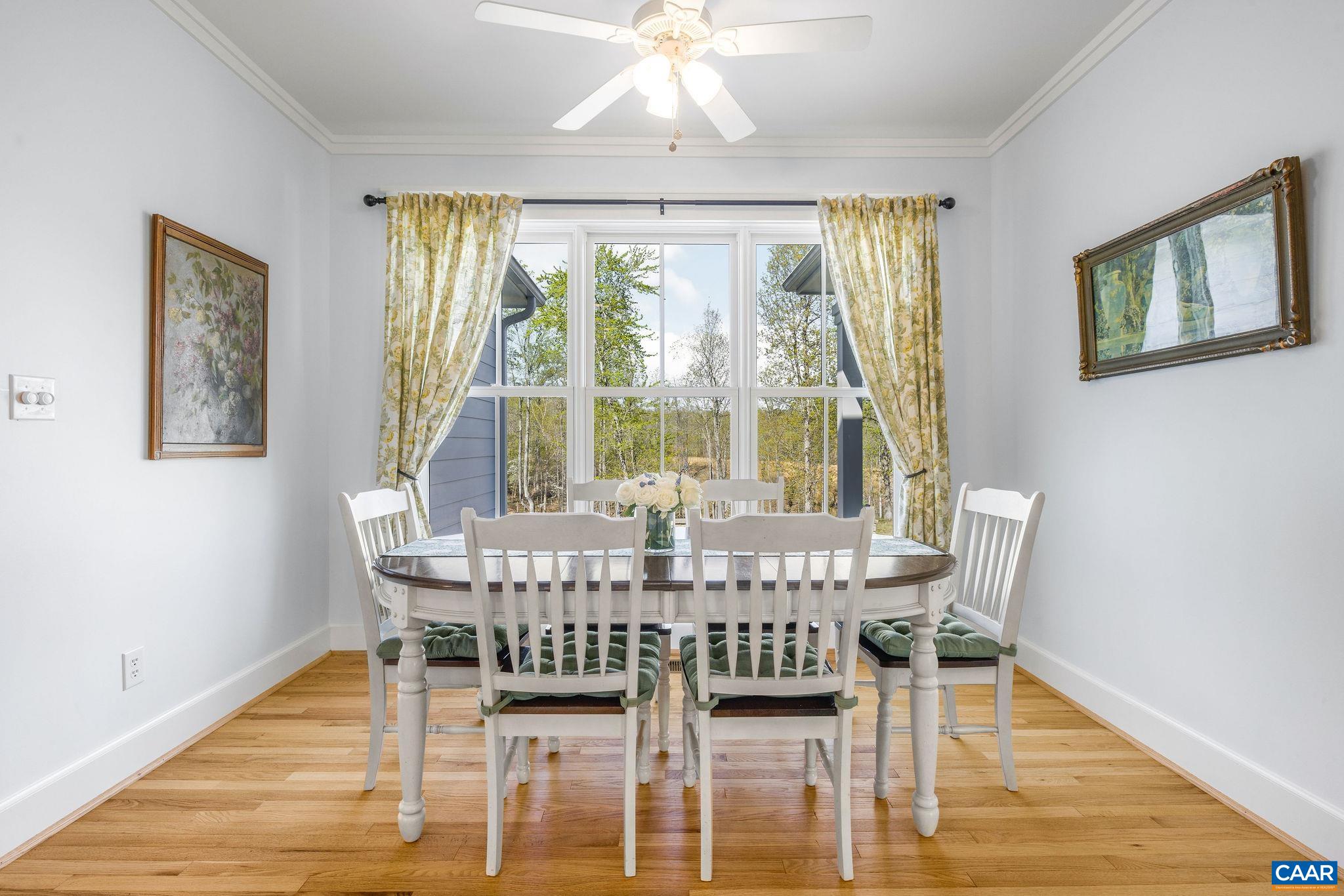 4764 Advance Mills Road Earlysville, VA 22936 - Photo 40 of 72 a view of a dining room with furniture wooden floor and chandelier