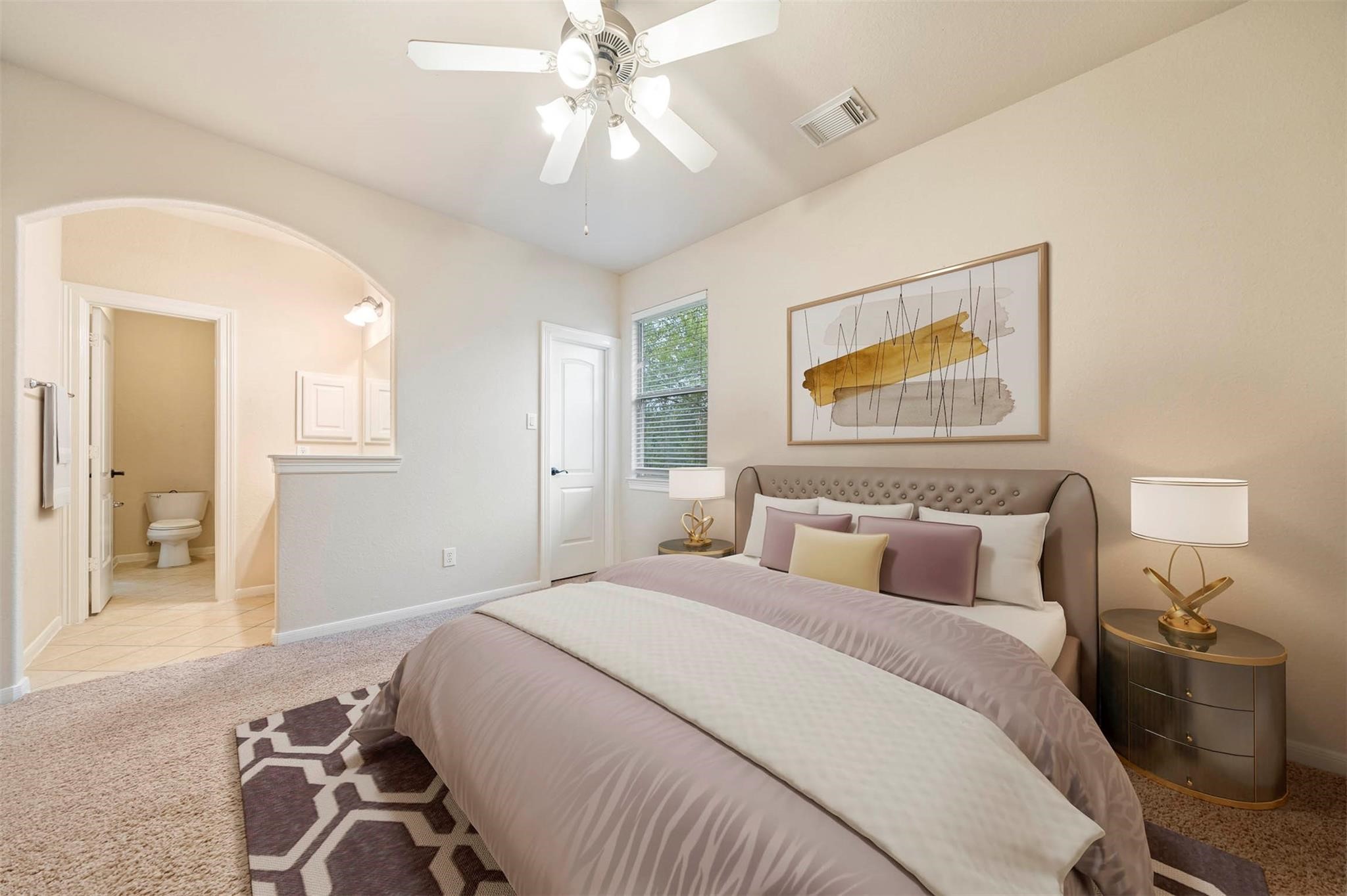 3 Etude Court Spring, TX 77382 - Photo 22 of 45 a bedroom with a bed and a chandelier