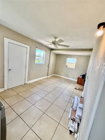 a view of a yard with a tree