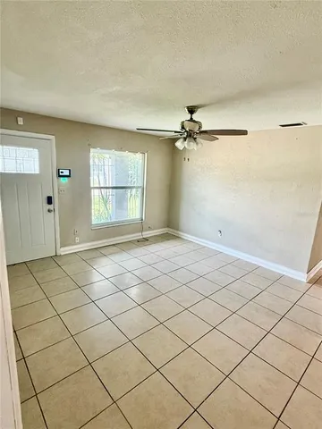 a view of a livingroom and window
