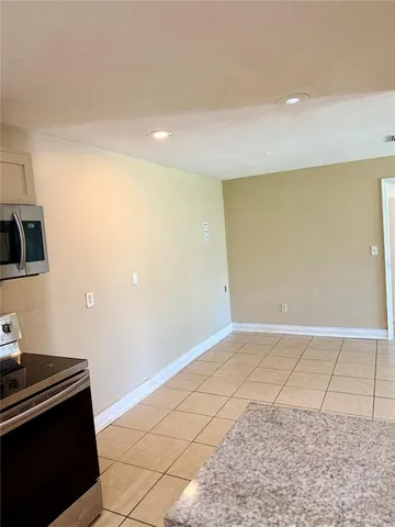 a kitchen with stainless steel appliances granite countertop a sink and a stove