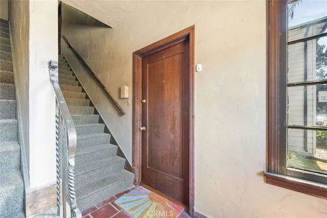 a kitchen with stainless steel appliances granite countertop a refrigerator and a stove