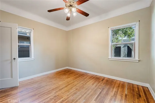 a view of a livingroom with a fireplace and wooden floor