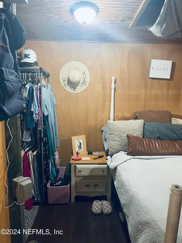 a bed room with a bed and a lamp