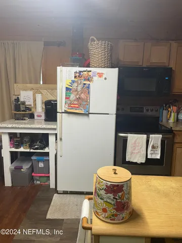 a bathroom with a sink a toilet and a shower