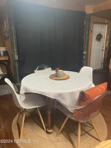 a dining room with a table and chairs