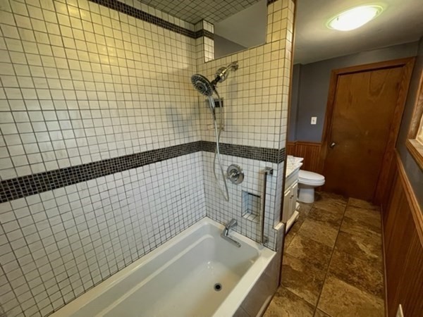 124 Wells Street Greenfield, MA 01301 - Photo 14 of 19 a bathroom with a bathtub and a shower