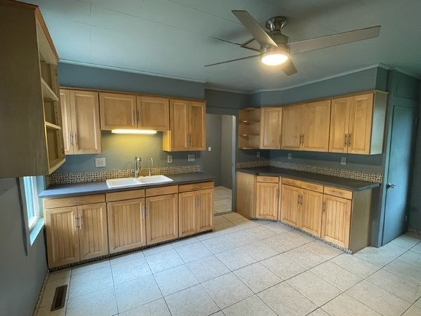 124 Wells Street Greenfield, MA 01301 - Photo 3 of 19 a kitchen with granite countertop a sink stainless steel appliances and cabinets