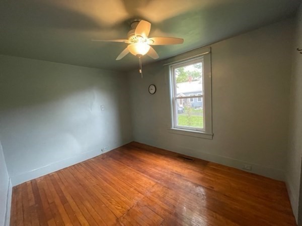 124 Wells Street Greenfield, MA 01301 - Photo 7 of 19 a view of an empty room and window