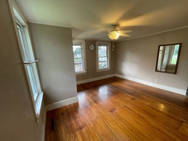 124 Wells Street Greenfield, MA 01301 - Photo 8 of 19 an empty room with wooden floor and windows