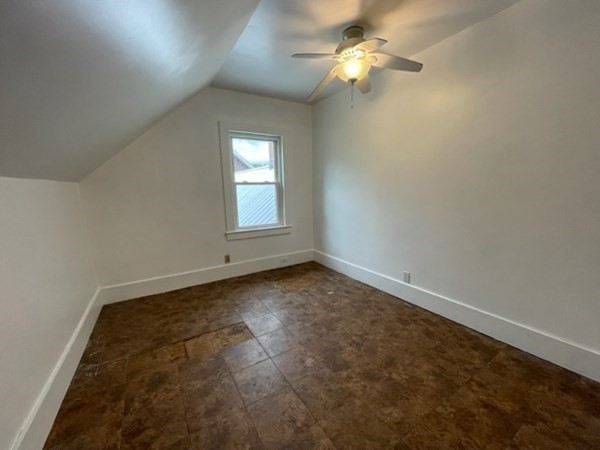 124 Wells Street Greenfield, MA 01301 - Photo 9 of 19 an empty room with a window and a fan