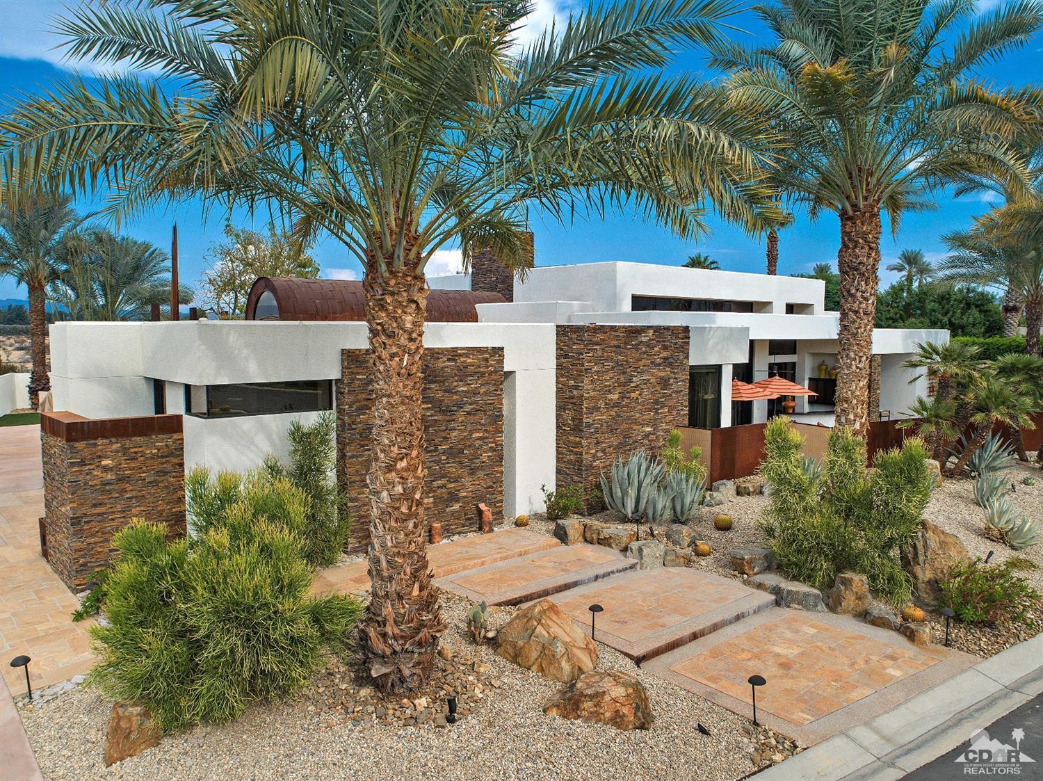 31 Sun Ridge Circle Rancho Mirage, CA 92270 - Photo 3 of 45 a view of a palm trees front of house