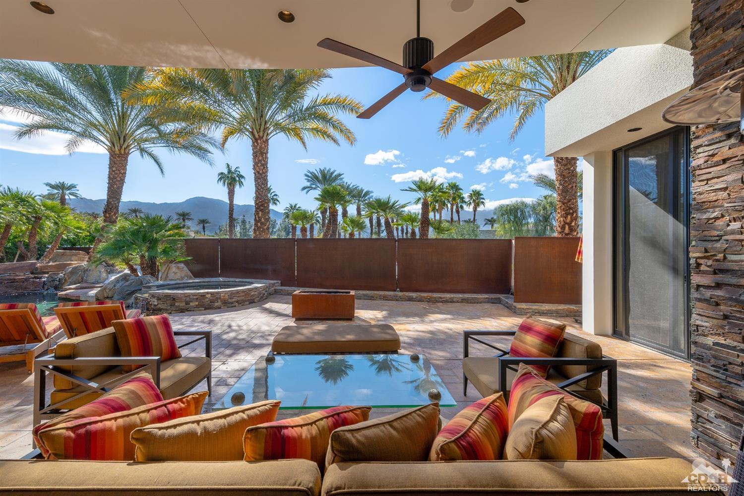 31 Sun Ridge Circle Rancho Mirage, CA 92270 - Photo 8 of 45 a view of a patio with couches chairs and a potted plant