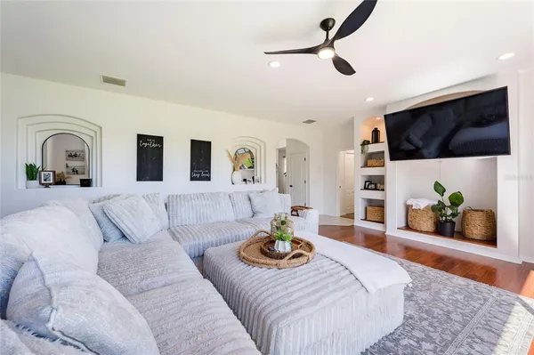 a living room with furniture and a large window