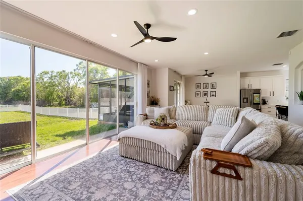 a bathroom with a granite countertop toilet a sink and a bathtub