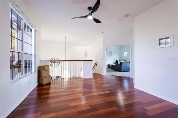 a bed room with furniture and a flat screen tv