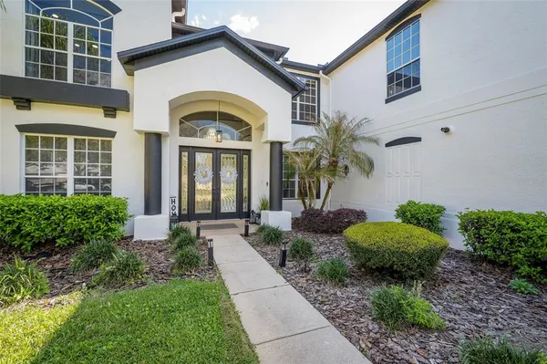 a view of a workspace with furniture and wooden floor