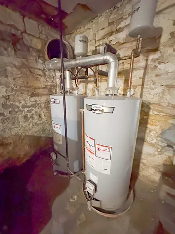 a view of a kitchen with a sink and furniture