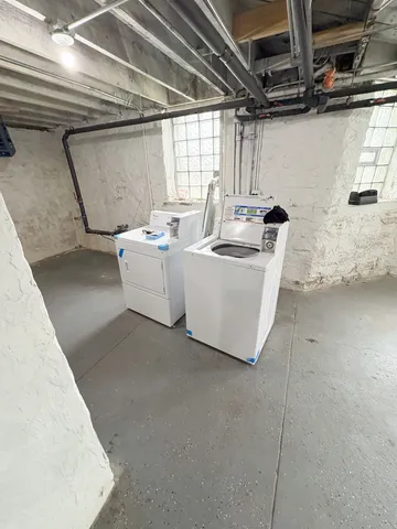 a view of a patio with table and chairs