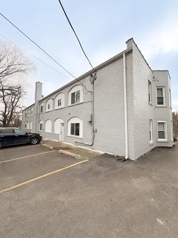a view of a street with a building
