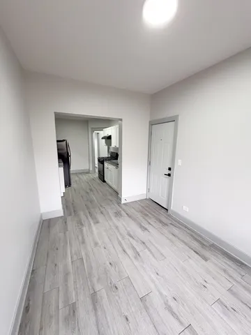 a view of a livingroom with wooden floor