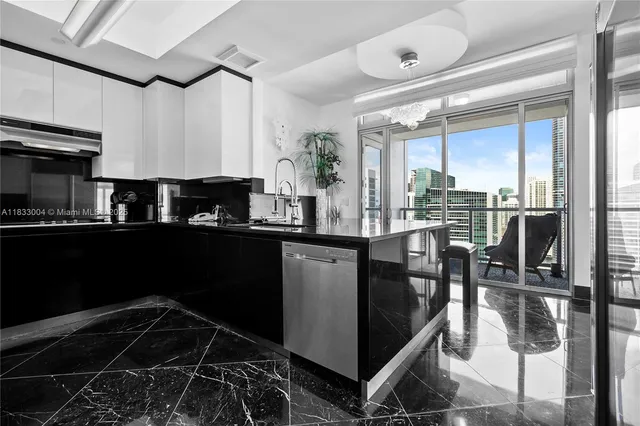 a kitchen with counter top space cabinets and appliances