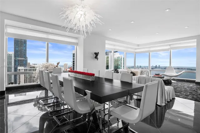 a view of a dining room with furniture window and outside view