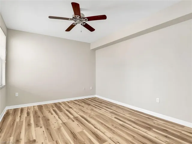 a view of room with a ceiling fan