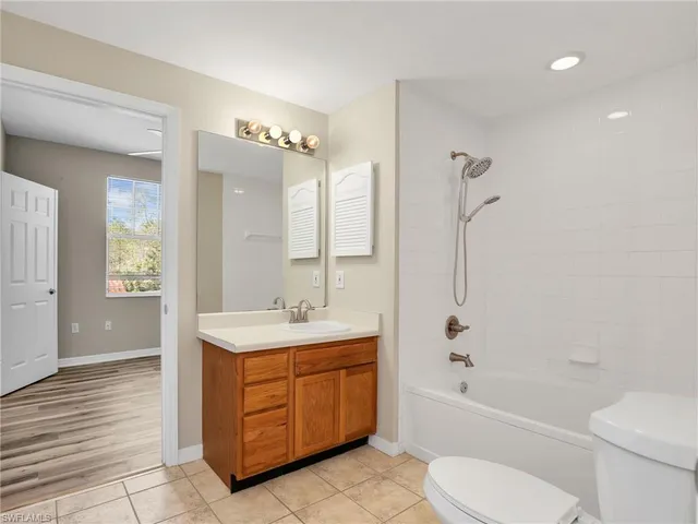 a bathroom with a sink a toilet and bathtub