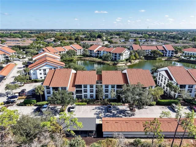 an aerial view of a house with yard swimming pool and outdoor seating