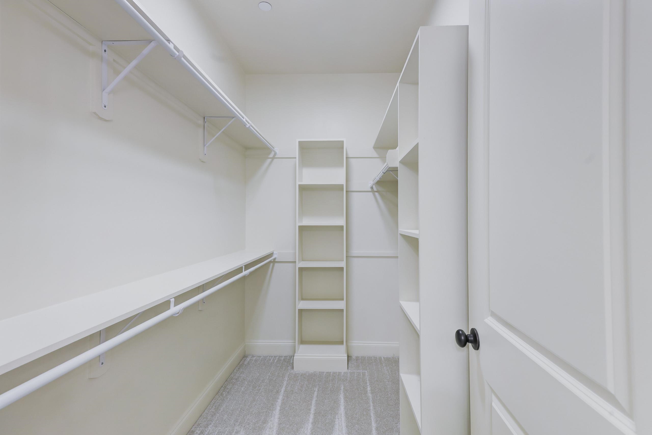 897 Ufton Alley Collierville, TN 38017 - Photo 18 of 32 a view of walk in closet with empty racks